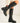 Schwarze hohe Stiefel mit Gummiband und goldenen Details